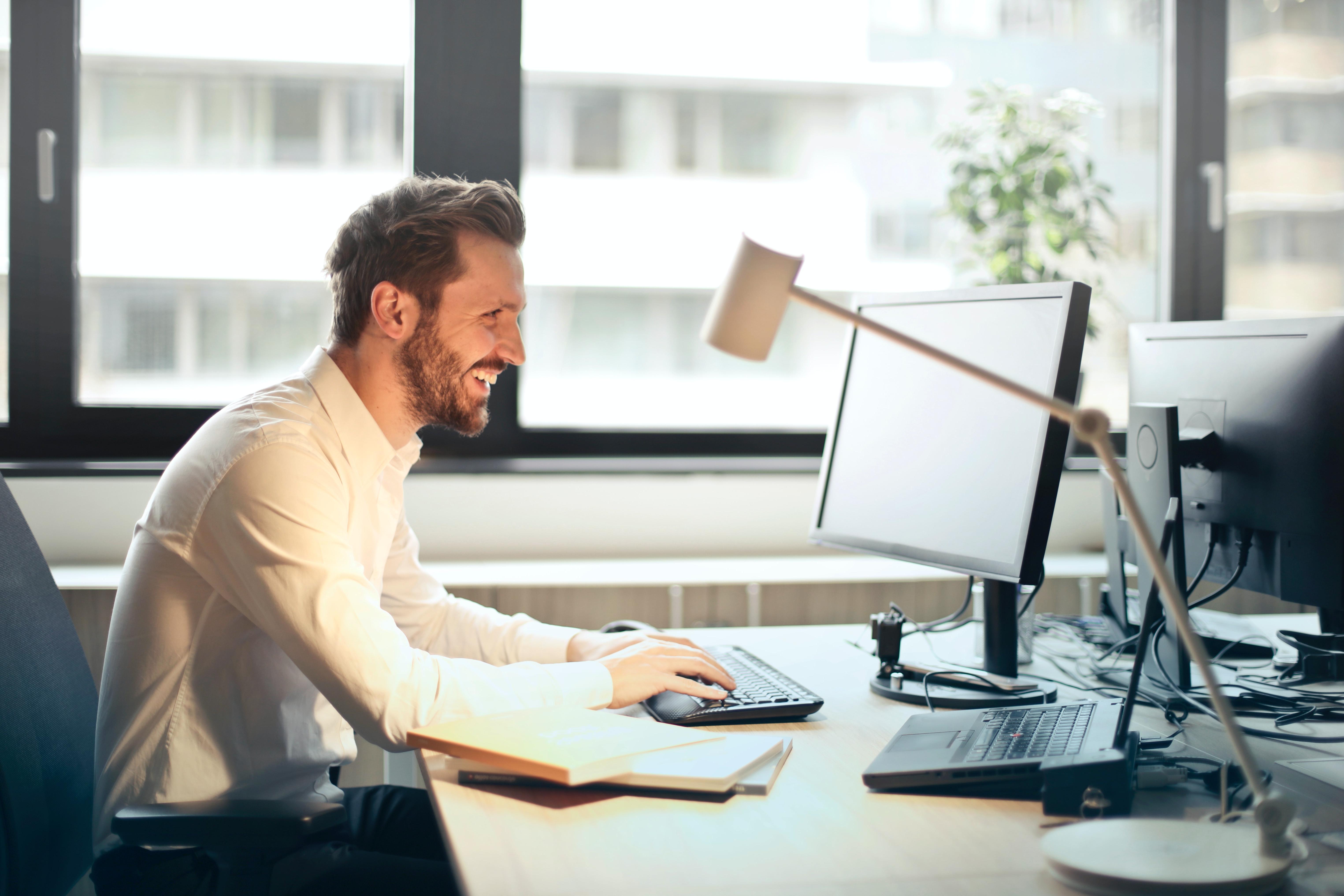 A business man working at his computer in his office